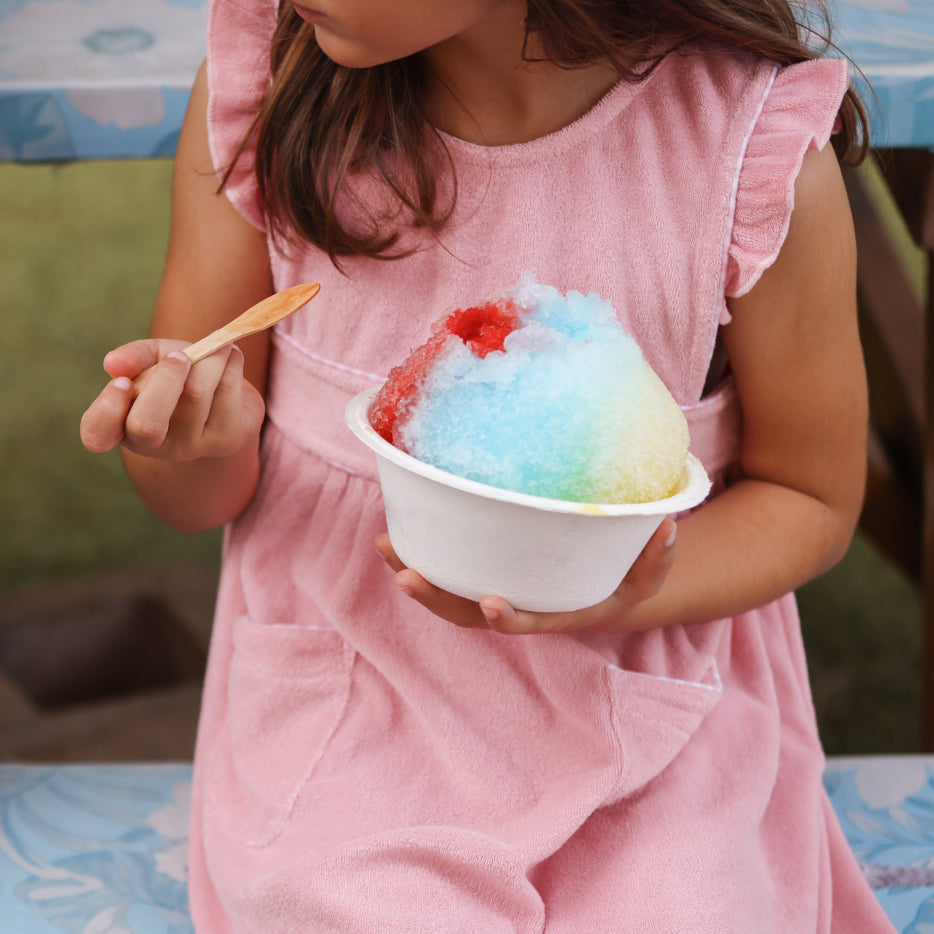 girl wearing pink terry dress wearing a snowcone